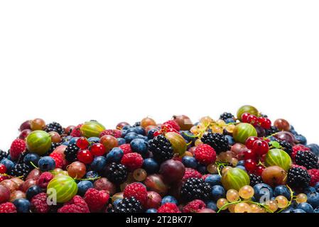 Gooseberries, blueberries, mulberry, raspberries, white and red currants isolated on white background. Stock Photo