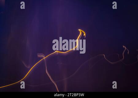 Orange yellow lines on violet background color texture Stock Photo
