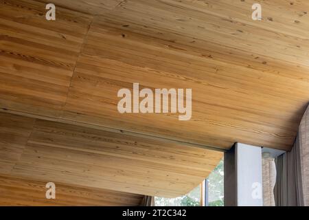 Bent ceiling made of wooden planks, parametric architecture background photo Stock Photo