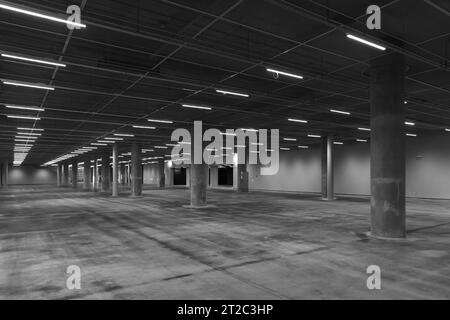 Parking Garage Underground Interior, Neon Lights In Dark Industrial  Building, Modern Public Construction Stock Photo, Picture and Royalty Free  Image. Image 21403100.