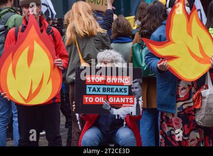 London, UK. 18th October 2023. Climate activists gather outside Standard Bank in the City of London in protest against the East African Crude Oil Pipeline (EACOP), calling on the bank to stop financing the project. Credit: Vuk Valcic/Alamy Live News Stock Photo