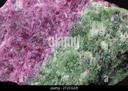 Closeup Ruby Zoisite (Anyolite), mined in Tanzania. Red Ruby, Green Zoisite, and black parasite visible. Stock Photo