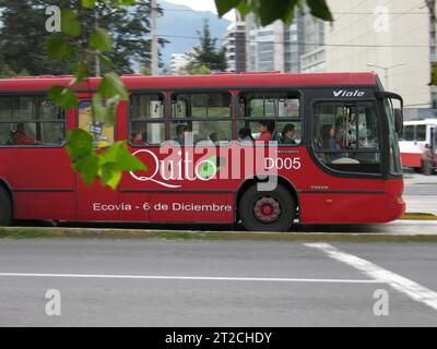 Quito, Ecuador - April 3, 2006: Red bus and yellow taxi in Quito Ecuador South America Stock Photo