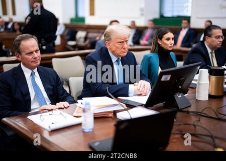 (231018) -- NEW YORK, Oct. 18, 2023 (Xinhua) -- Former U.S. President Donald Trump (2nd L, Front) sits in the courtroom during his civil fraud trial at New York State Supreme Court in New York, the United States, on Oct. 18, 2023. A New York court employee was arrested Wednesday after trying to approach former U.S. President Donald Trump at a Manhattan courtroom, where Trump made another appearance in his civil fraud trial. Trump was at the courtroom Tuesday and Wednesday for the third week of the trial, after he attended the first three days of the trial when it got underway earlier this mont Stock Photo