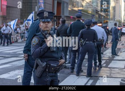 NEW YORK, N.Y. – October 13, 2023: New York City police officers are seen in Manhattan during pro-Israeli and pro-Palestinian demonstrations. Stock Photo