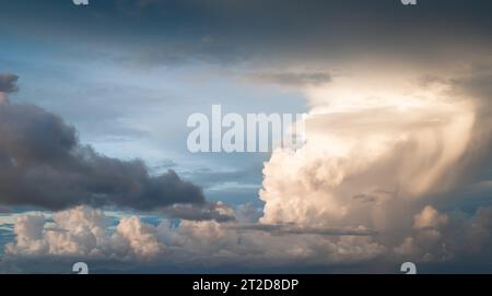 The sky with dark gray clouds before storm and rain in rainy season. Stock Photo
