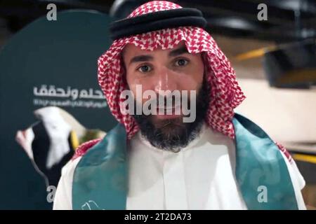 File photo - French football player Karim Benzema is seen dancing the traditional ‘aardha’, sometimes also known as the sword dance’, as he celebrates with his club ‘Al-Ittihad’, the Saudi National Day (September 23), in Jeddah, Kingdom of Saudi Arabia, on September 27, 2023. Benzema is wearing traditional Saudi clothes : a ghutra or keffieh on his head, a white dishdasha or thobe. 2022 Ballon d’Or winner Karim Benzema finds himself mired in political controversy amid the ongoing Israel-Hamas war. Speaking to French outlet CNews on Monday, French Interior Minister Gérald Darmanin accused Benze Stock Photo