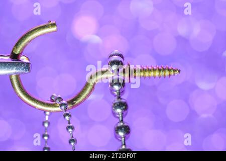 A colorful mix of nails and screws with eyelets and hoes Stock Photo