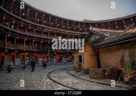 TULOU CLUSTER, FUJIAN, CHINA. FEBRUARY 17th, 2021: Tulou, Fujian province, China Hakka architecture, earthen building, horizontal view on the inner ci Stock Photo