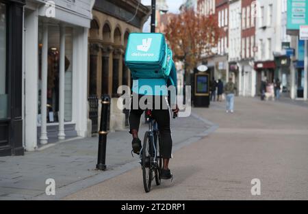 File photo dated 05/11/20 of a Deliveroo rider. Food delivery giant Deliveroo has reported rising sales as it begins to pare back declining order numbers despite a 'tough' consumer backdrop. The London-listed multinational business posted a 5% constant currency rise in sales by gross transaction value (GTV) across the group in the third quarter. Issue date: Thursday October 19, 2023. Stock Photo