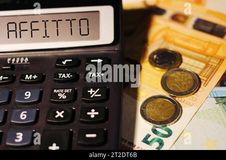 Calculator with the word "affitto" on the display, translating with "Rent" in italian. Stock Photo