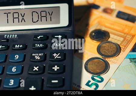 Tax Day words written on calculator display ,Business Concept. Stock Photo