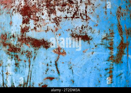 Texture of yellow rusty old shabby coarse rusty unique rust, oxidized metal, iron on blue peeling paint, background Stock Photo