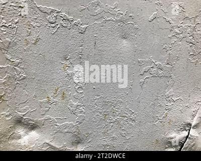 texture, silver colored metal sheet. metal is heterogeneous, porous, interspersed with paint. potholes, damage, cuts on the metal. on the metal inters Stock Photo