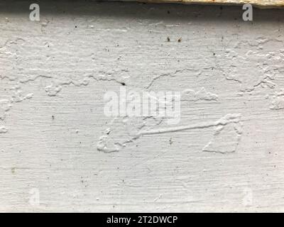 texture, white metal sheet. metal is heterogeneous, porous, interspersed with paint. the metal sheet is colored non-uniformly. matte smooth texture. Stock Photo