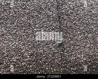 texture, many stones of different colors. natural background. small stones, home decoration, decor and wall decoration. liquid wallpaper. shiny, uneve Stock Photo