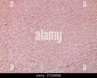 texture, metallic background with coloring. the metal sheet is painted pink. heterogeneous, voluminous texture with splashes of paint. dirt, debris an Stock Photo