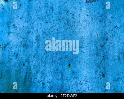 texture in blue. bright, matte surface. there is a patch on the texture, old texture with damaged paint. rusty texture, damage, rust on the background Stock Photo