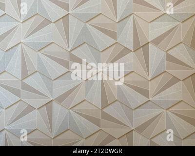 Texture abstract from many geometric shapes of yellow gold color hexagons. The background. Stock Photo