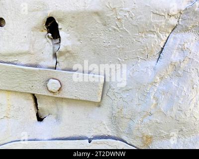 New painted gray matt chrome metal rivets on iron sheet. Stock Photo