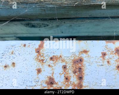 Texture of the old, old, rotten, cracked, dilapidated, dilapidated, painted, swollen paint of a peeling textured metal with divorces, patterns from be Stock Photo