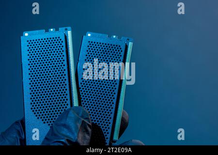 the hand of a computer technician holds computer RAM chip. memory modules. Ddr and sdram storage. Computer technology. concept of PC hardware. DIMM DD Stock Photo