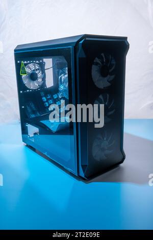 the case of the computer system unit with neon illumination . Computer technology. vertical photo Stock Photo