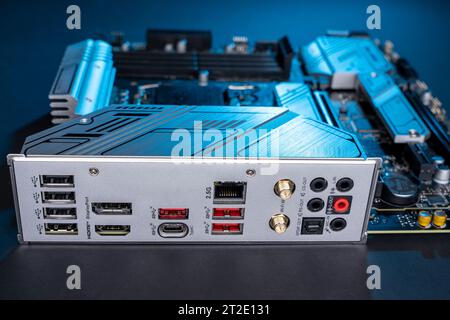 modern powerful and fast motherboard with connectors for HDMI and USB. PC hardware concept. internet cable connection slot Stock Photo