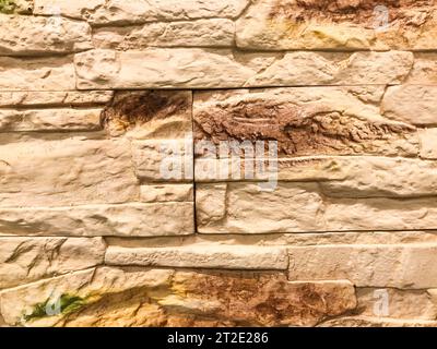 decorative brick for wall covering, texture. brown tile bricks, decorative material tiles, small bricks for wall covering. decorative brick glued to t Stock Photo