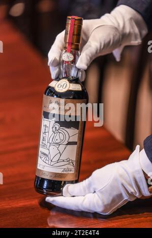 London, UK. 19th Oct, 2023. The most expensive bottle of Whisky, est £750,000-1 2000,000, was unveiled today at Sothebys, London.Aged in nCherry cask for 6 decades, only 40 bottles of the Macallan were bottled in 1926, this is one of only 12 bottles left Credit: Paul Quezada-Neiman/Alamy Live News Stock Photo
