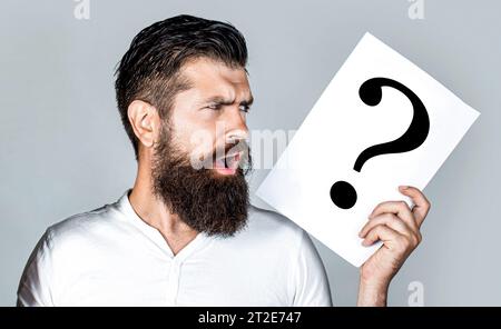 Man question. Male with question marks. Getting answers. Question mark, symbol. Concept - challenging issue, looking for the answer Stock Photo