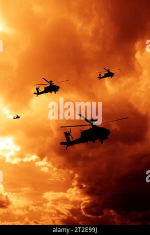 military helicopter in formation with dramatic sky Stock Photo