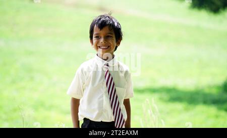 Portrait of Happy Indian school kids wearing school uniform. Skill India concept. Education concept. Rural India. Concept of friendship, education and Stock Photo