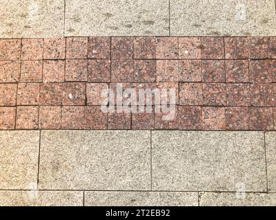 The brown texture of stone granite marble paving slabs. The background. Stock Photo