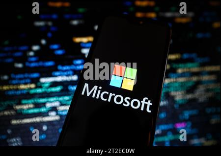 Poland. 18th Oct, 2023. In this photo illustration a Microsoft logo is displayed on a smartphone with programing codes on the background.economy, business, logo, logos, sign, brand, technology, online, smartphone, cellphone, mobile phone, phone, device (Photo by Omar Marques/SOPA Images/Sipa USA) *** Strictly for editorial news purposes only *** Credit: Sipa USA/Alamy Live News Stock Photo