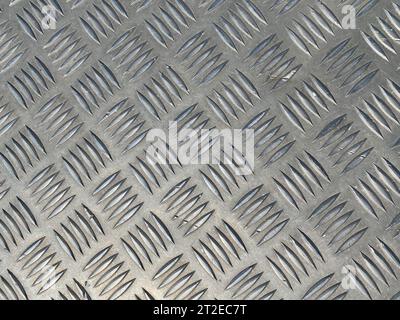 diamond shape metal background wrap around seamless pattern heavy metal texture. Stock Photo