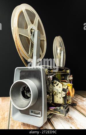 Old fashioned reel to reel projector machine in office of a market