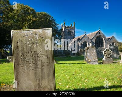 A 19th century grave in the graveyard of Charles King And Martyr Church, Peak Forest, Derbyshire, UK - a grade 2 listed building. Stock Photo