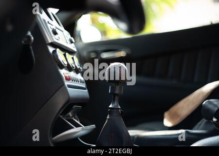 Car manual leather gear lever knob. Close up shot, selective focus, no people, generic car Stock Photo
