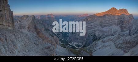 Beautiful alpine sunset over the Tofane mountains near Cortina, the heart of the Italian Dolomites. Golden mountain summits and deep glacial valley Stock Photo