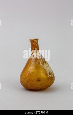 Glass perfume bottle Roman 1st century CE Translucent brownish yellow.Everted, rounded rim; cylindrical neck with tooling indent around base; conical body; uneven bottom with off-center hollow.Complete, but crack in body; pinprick bubbles; dulling, slight pitting, and iridescent weathering. View more. Glass perfume bottle. Roman. 1st century CE. Glass; blown. Early Imperial. Glass Stock Photo