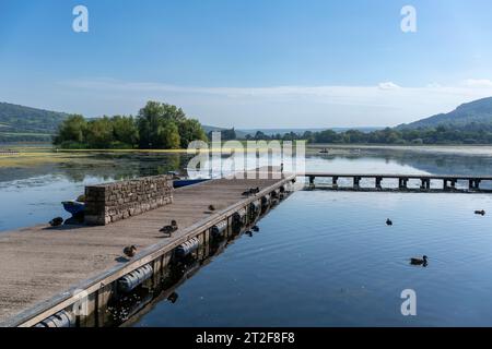 A view across Llangorse Lake in the Brecon Beacons National Park, photographed on a bright September day. Stock Photo