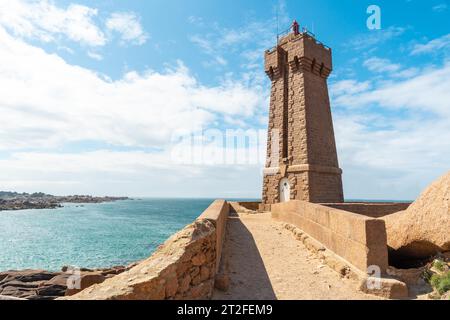 Lighthouse Mean Ruz is a building built in pink granite, port of Ploumanach, in the town of Perros-Guirec in the department of Cotes-d'Armor, in Stock Photo