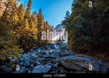 Vernal Falls waterfall of Yosemite National Park, photo from the river from where you can see the first waterfall with autumn retouching. California Stock Photo