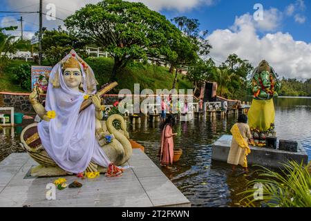 Left Goddess of Wisdom Sarasvati Saraswati Maa Wife Consort of Lord Brahma Right God Deity Statue in Elephant Shape Shape of Elephant Elephant God Stock Photo