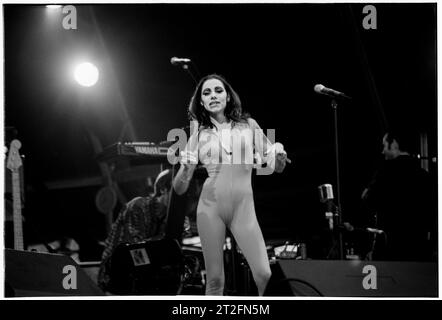 PJ HARVEY, GLASTONBURY FESTIVAL, 1995: PJ Harvey plays the Main Stage at the Glastonbury Festival, Pilton Farm, Somerset, England, 24 June 1995. In 1995 the festival celebrated its 25th anniversary. There was no pyramid stage that year as it had burned down. Photo: ROB WATKINS.   INFO: PJ Harvey is an acclaimed British singer-songwriter and musician known for her distinctive voice and eclectic style. With multiple awards, including the Mercury Prize, her influential work spans rock, punk, and alternative genres, making her a pivotal figure in contemporary music. Stock Photo