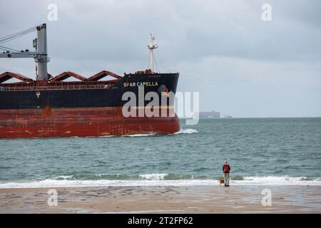 the bulk carrier vessel Star Capella is passing the beach in Dishoek on Walcheren, Zeeland, Netherlands. der Massengutfrachter Star Capella passiert d Stock Photo