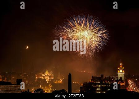 Fireworks over Edinburgh Castle with view of the city. Finale of Edinburgh International Festival in United Kingdom. Stock Photo
