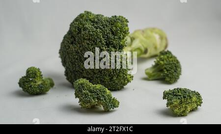 Healthy food. Vibrant broccoli pieces are arranged to showcase their ...