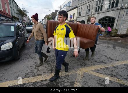 The clean up gets underway on Main street in Midleton, Co Cork, after extensive damage caused by flooding following Storm Babet, the second named storm of the season, swept in. Picture date: Thursday October 19, 2023. Stock Photo